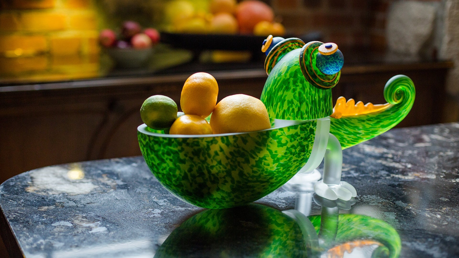 Borowski glass Chameleon fruit bowl on a kitchen counter.