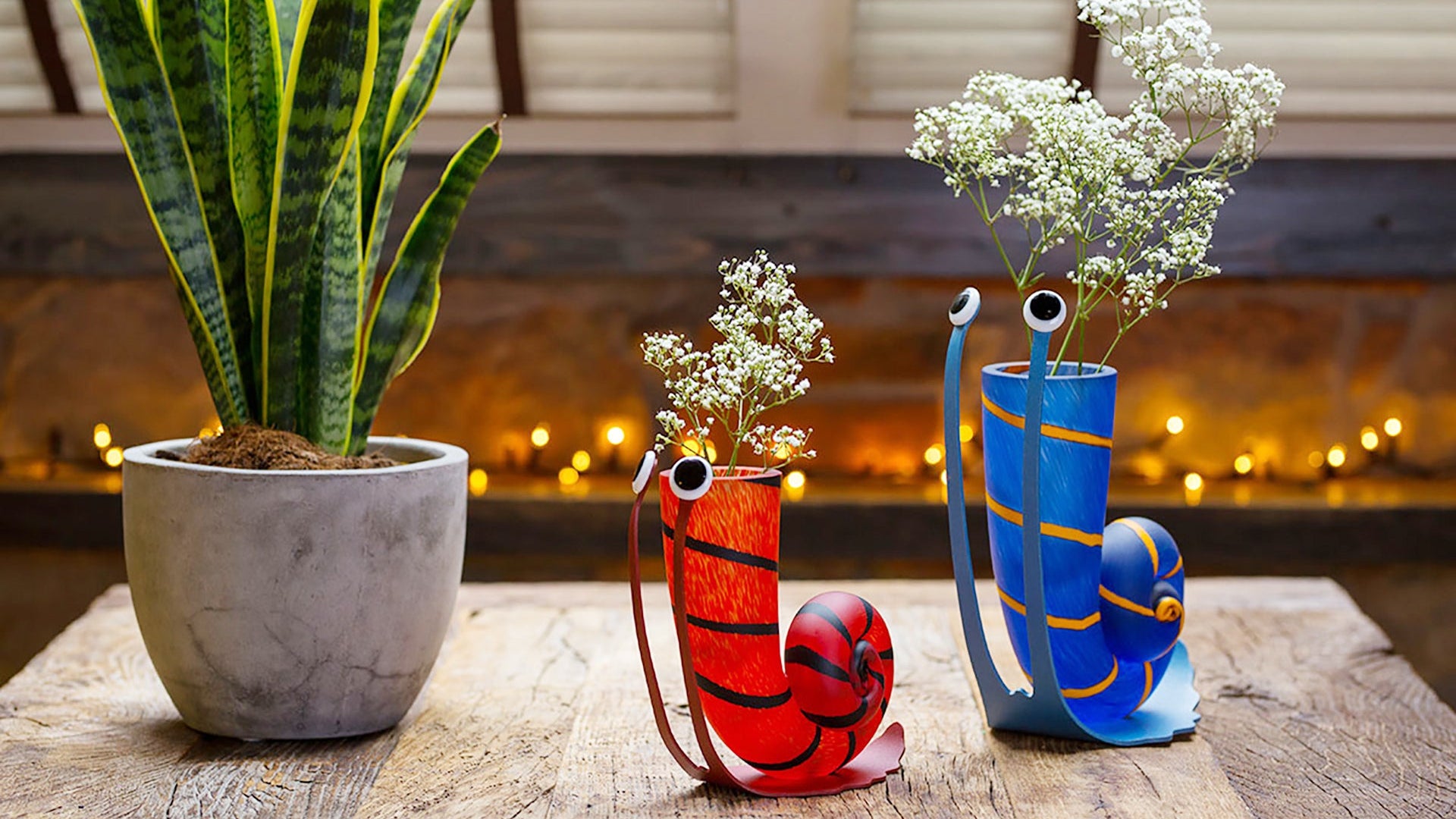 Borowski Slow \jack vases on a wooden surface with a plant in the background