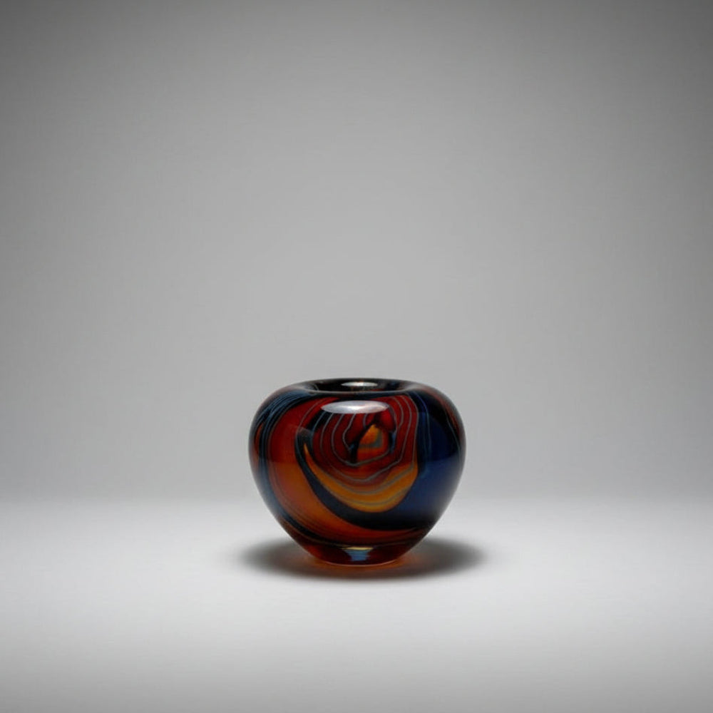 Cascade Colorful glass vase on a white floor with a neutral wall background