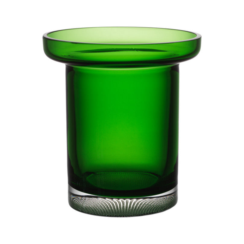 Green glass candle holder on a white background