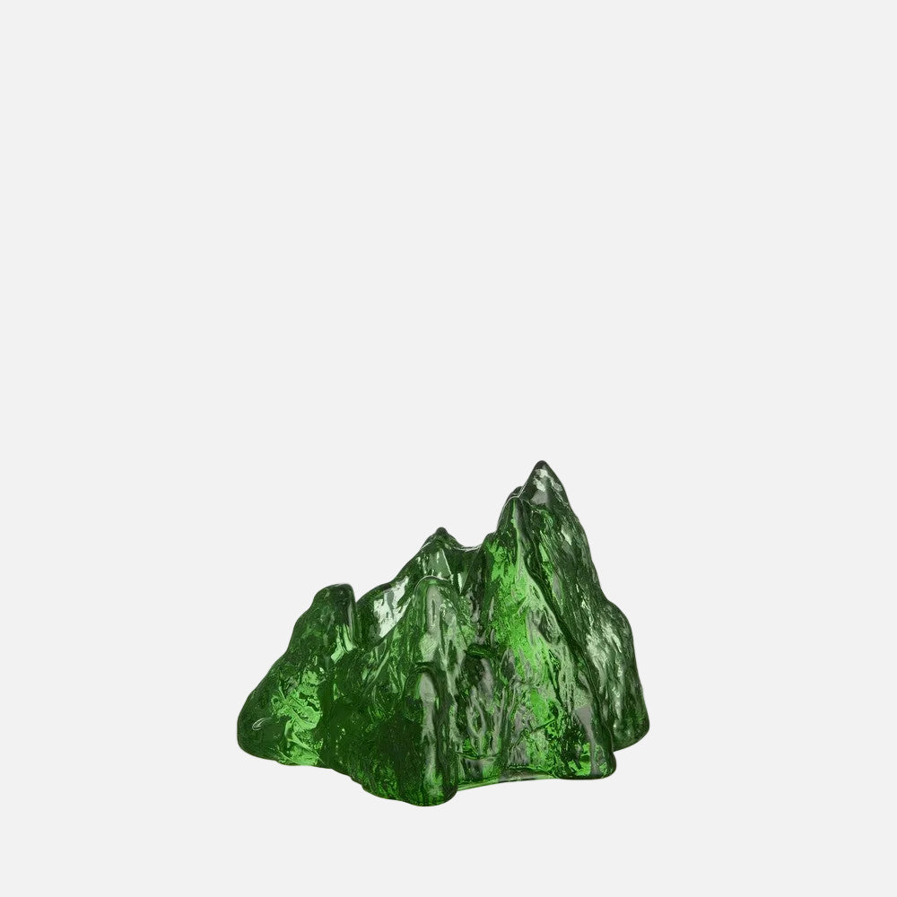 The Rock votive Green crystal mountain-like sculpture on a white background