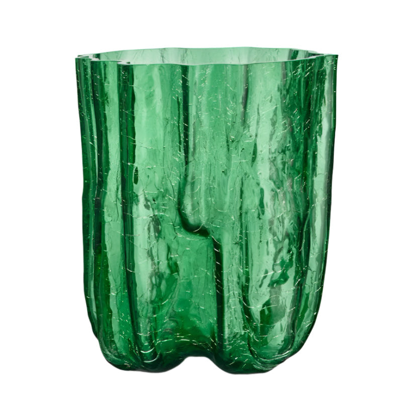 Green glass vase with textured surface on a white background