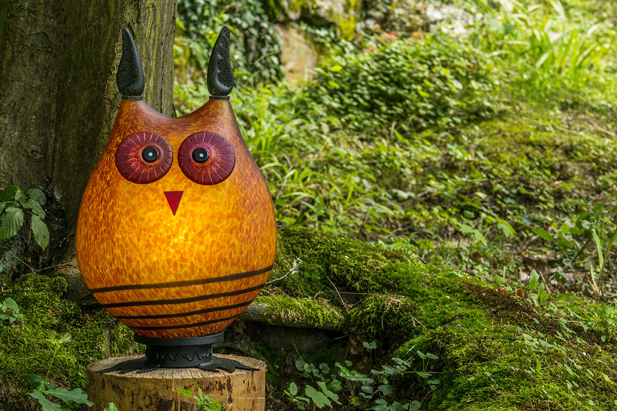 Borowski Glass Gourd owl decoration in a natural outdoor setting