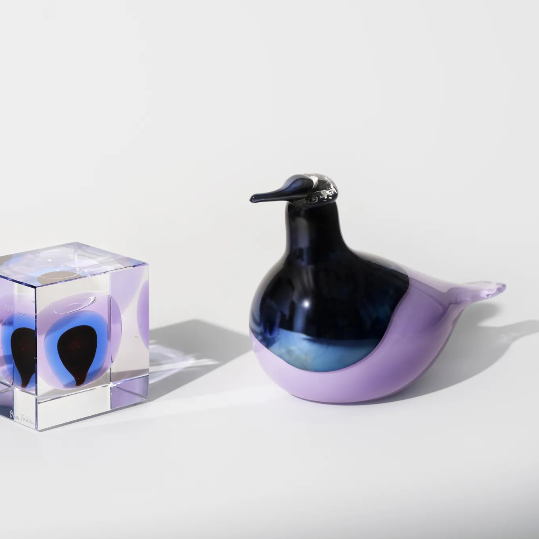 Toikka bird glass art pieces on a white background