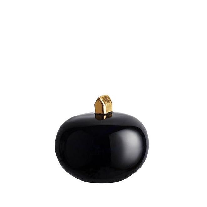 Kosta Boda ceystal Black decorative object with a gold top on a white background
