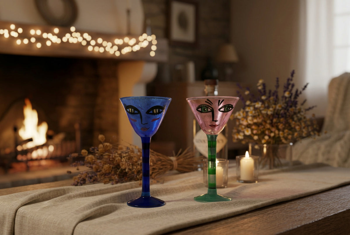 Kosta Boda Open Minds Two hand-painted glass goblets with stylized faces, 