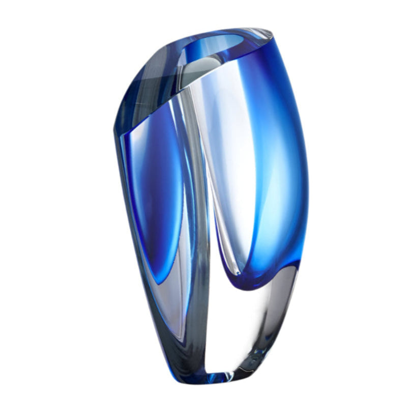 Blue glass vase on a light gray background