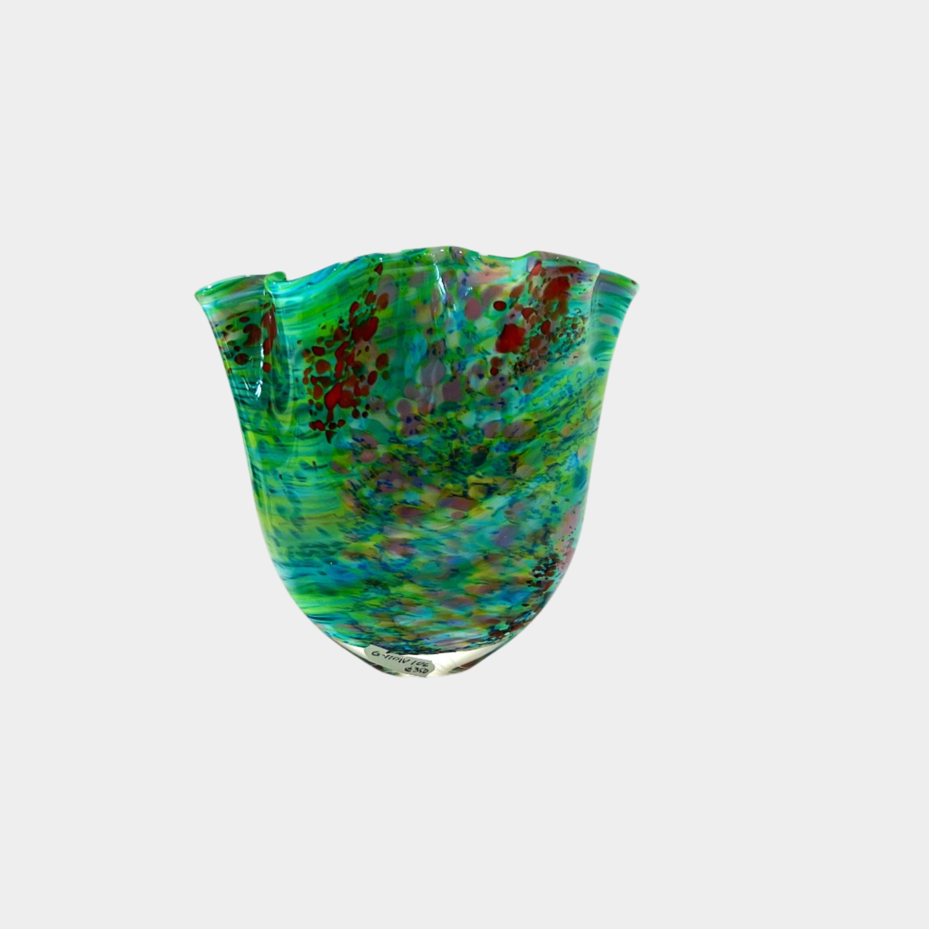Multicolored glass vase on a white background