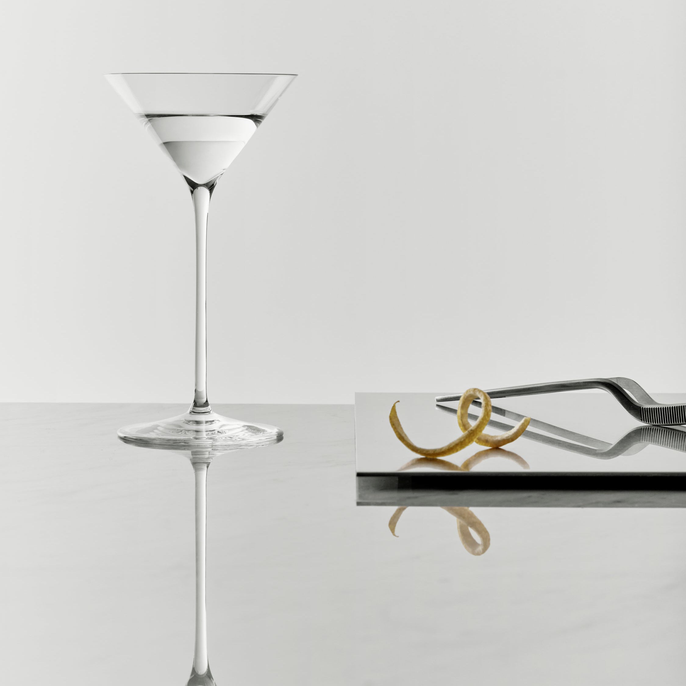 Orrefors Frantzen Clear martini glass on a light gray background