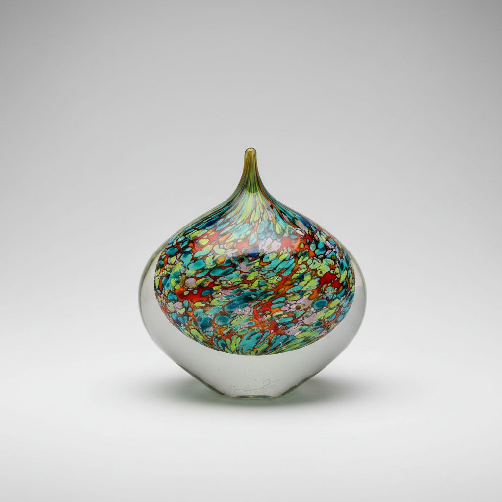Multicolored glass vase on a white background