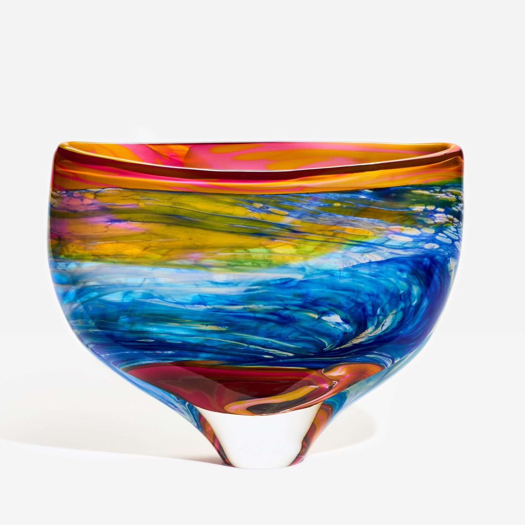 Multicolored glass bowl on a white background