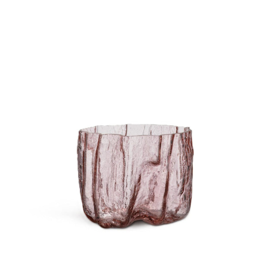 Pink glass vase with textured surface on a white background