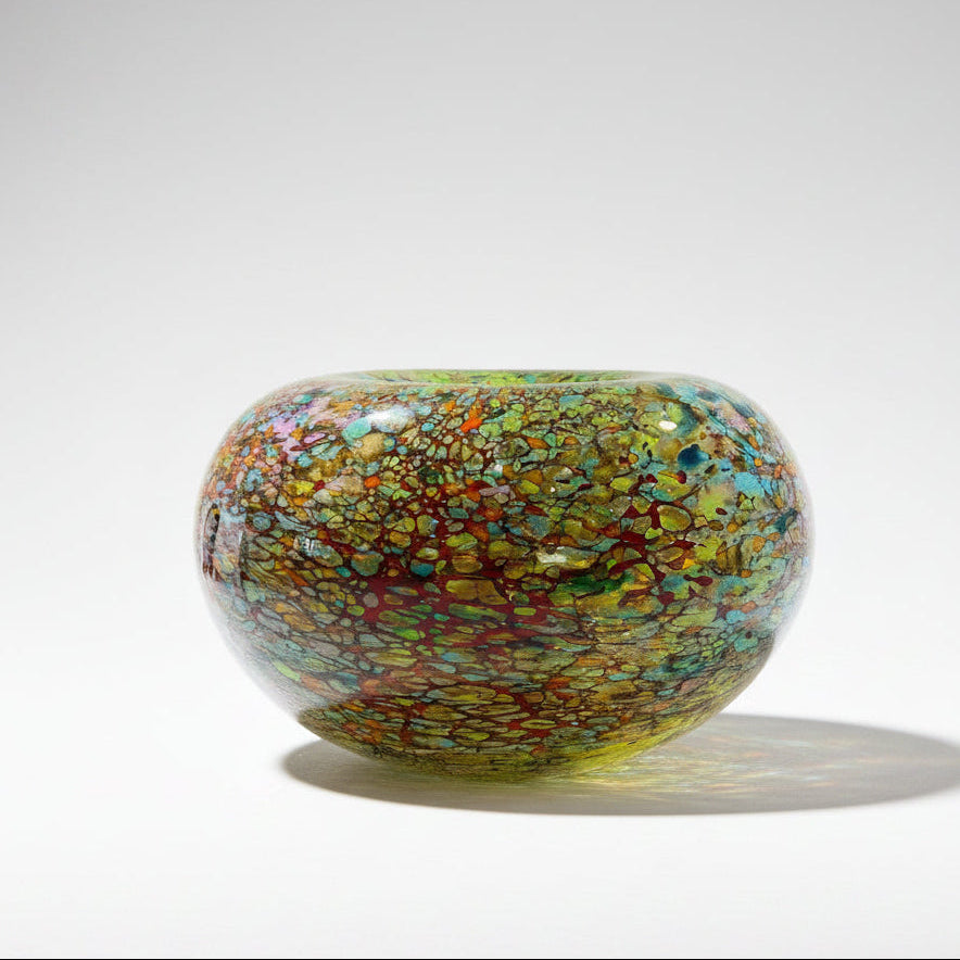 Peter Layton's Reef glass bowl on a white surface with a light beige background
