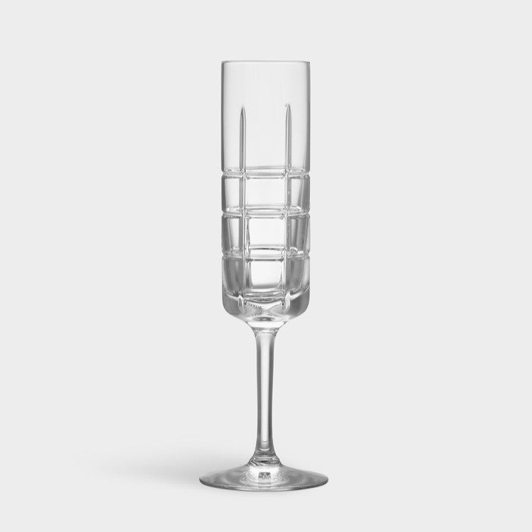Clear champagne glass with geometric pattern on a white background